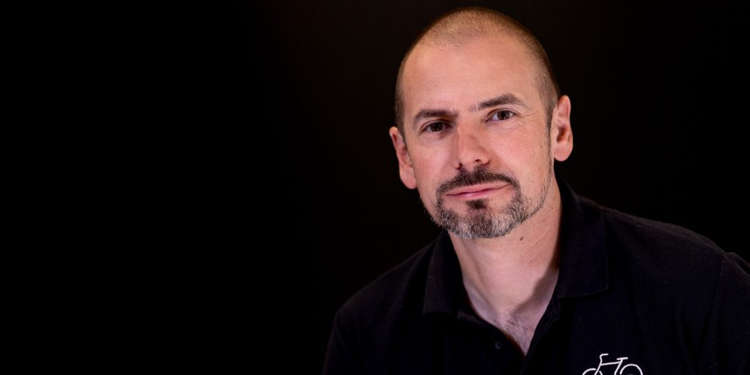 Steve Garidis, bicycle association profile image against a dark background