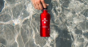SIGG bottle. Red metallic bottle in clear, swiss waters