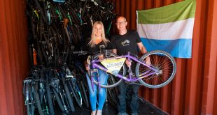 Director of Re Cycle Charlotte Ward and Warehouse Manager Mark Pamment loading the 150000th bike. Photo by Matt Grayson Re-Cycle sends 150,000th bike to Africa