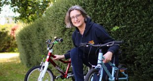 Karen Gee with 2 kids bikes - landscape hero