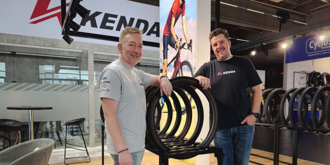 Pim from Kenda and Hamish from Brandon Cyclesports pose for a photo at Eurobike to announce their new partnership