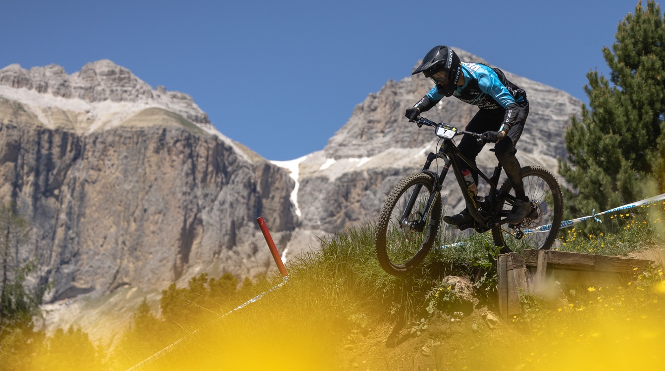 Mountain biker racing in mountainous landscape