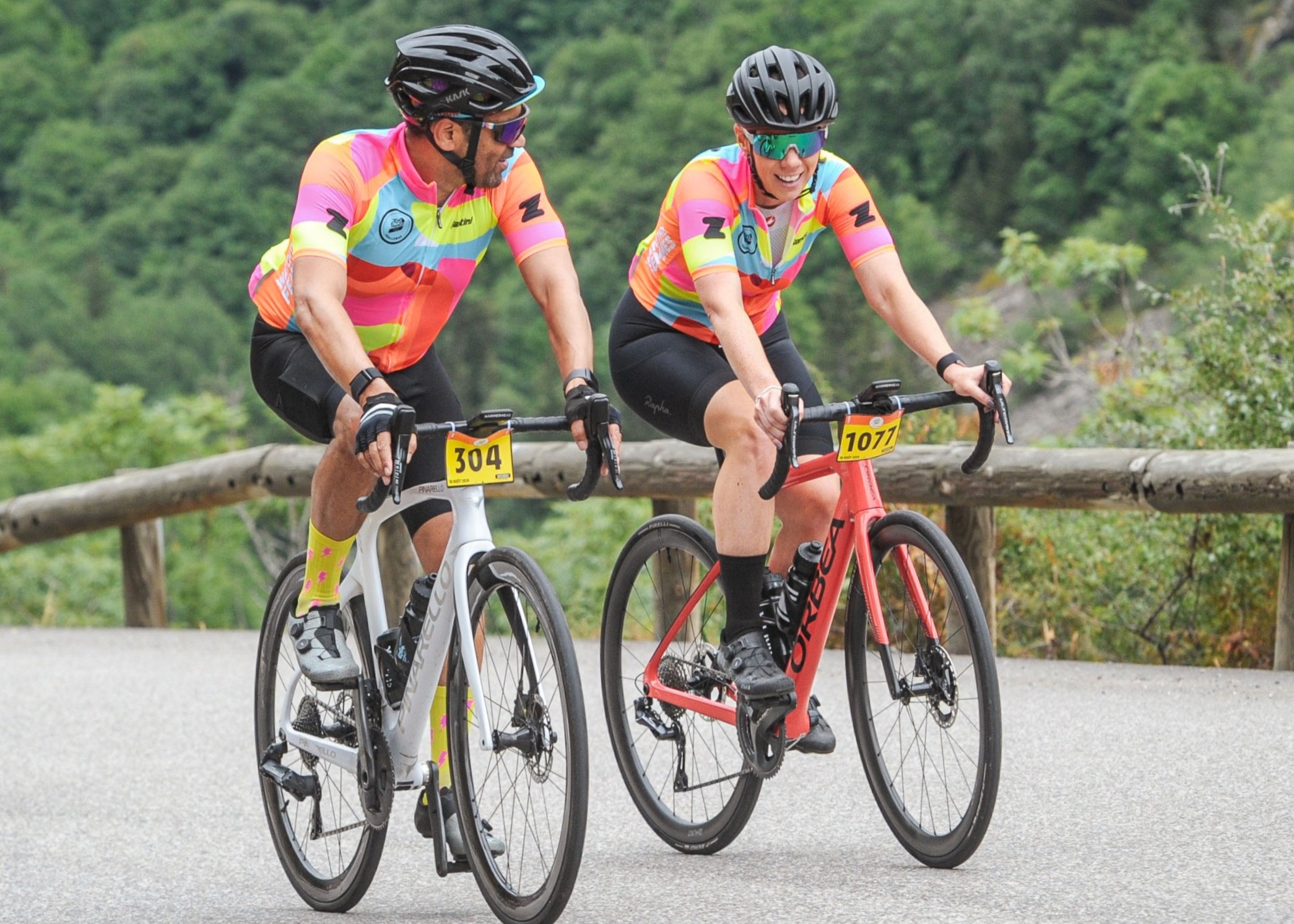 Wayne riding the Tour de France Femmes with colleague, Rachael Burnside