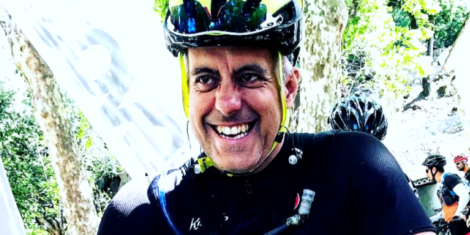A picture of Chris Hewings with a bicycle helmet on a ride