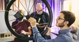 Man holding carbon road bike wheel at Eurobike